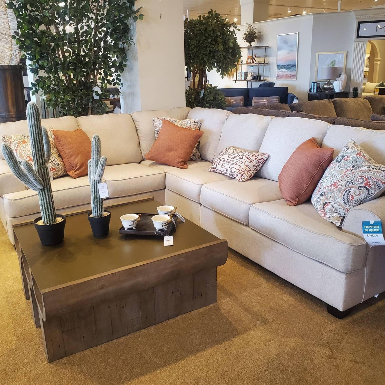 Cream Sectional with Orange Accent Pillows - Furniture of Dalton 